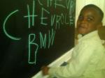 grant writing car names on chalkwall